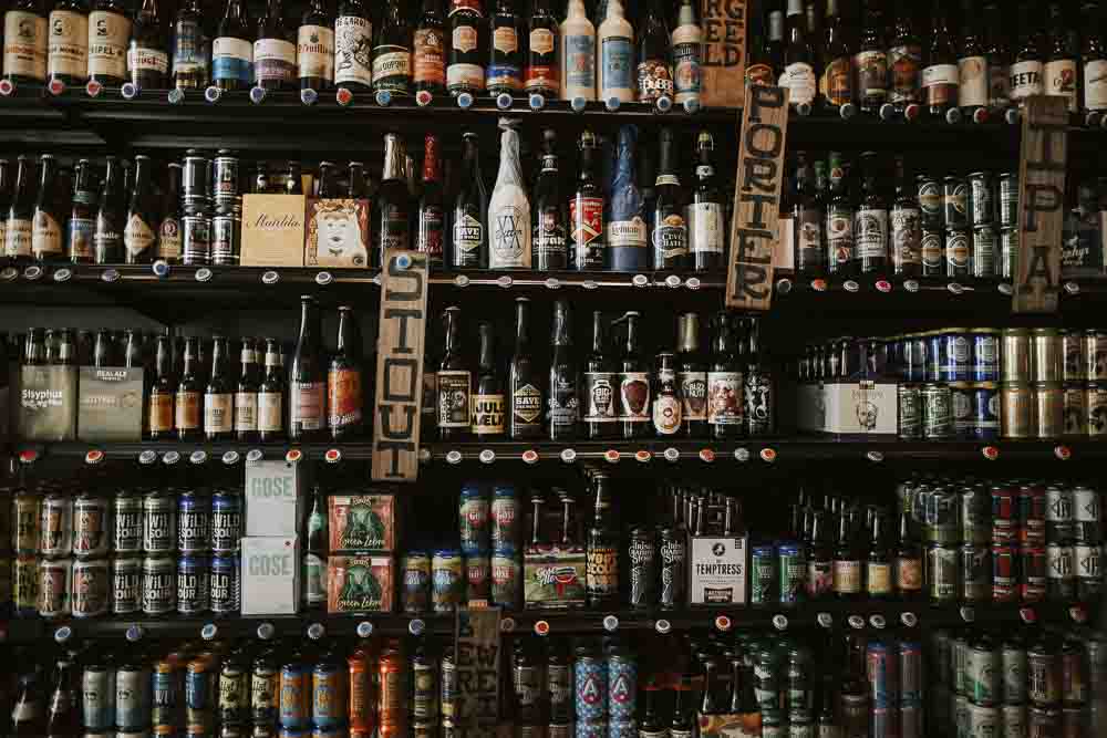 Frontal image of shelves full of beer bottles